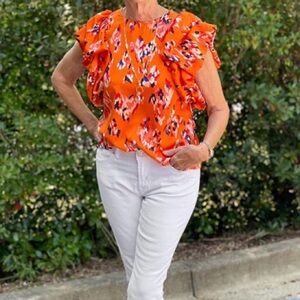 THML ‘Geneva’ puff sleeve top. Orange with blue/white/red abstract print. Size L